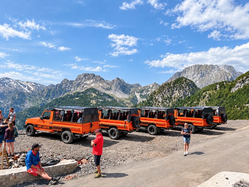 Jeep safari to Theth: Off Limits 4x4 jeeps lined up under the peaks of the Albanian Alps