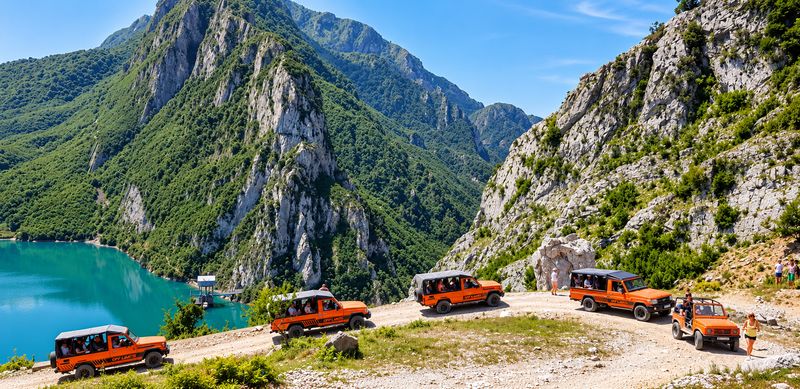 4x4 tour convoy on the mountain track above the Bovilla canyon and lake